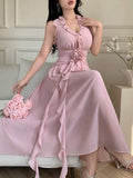Blush pink halter dress with 3D waist rose and cascading ruffle