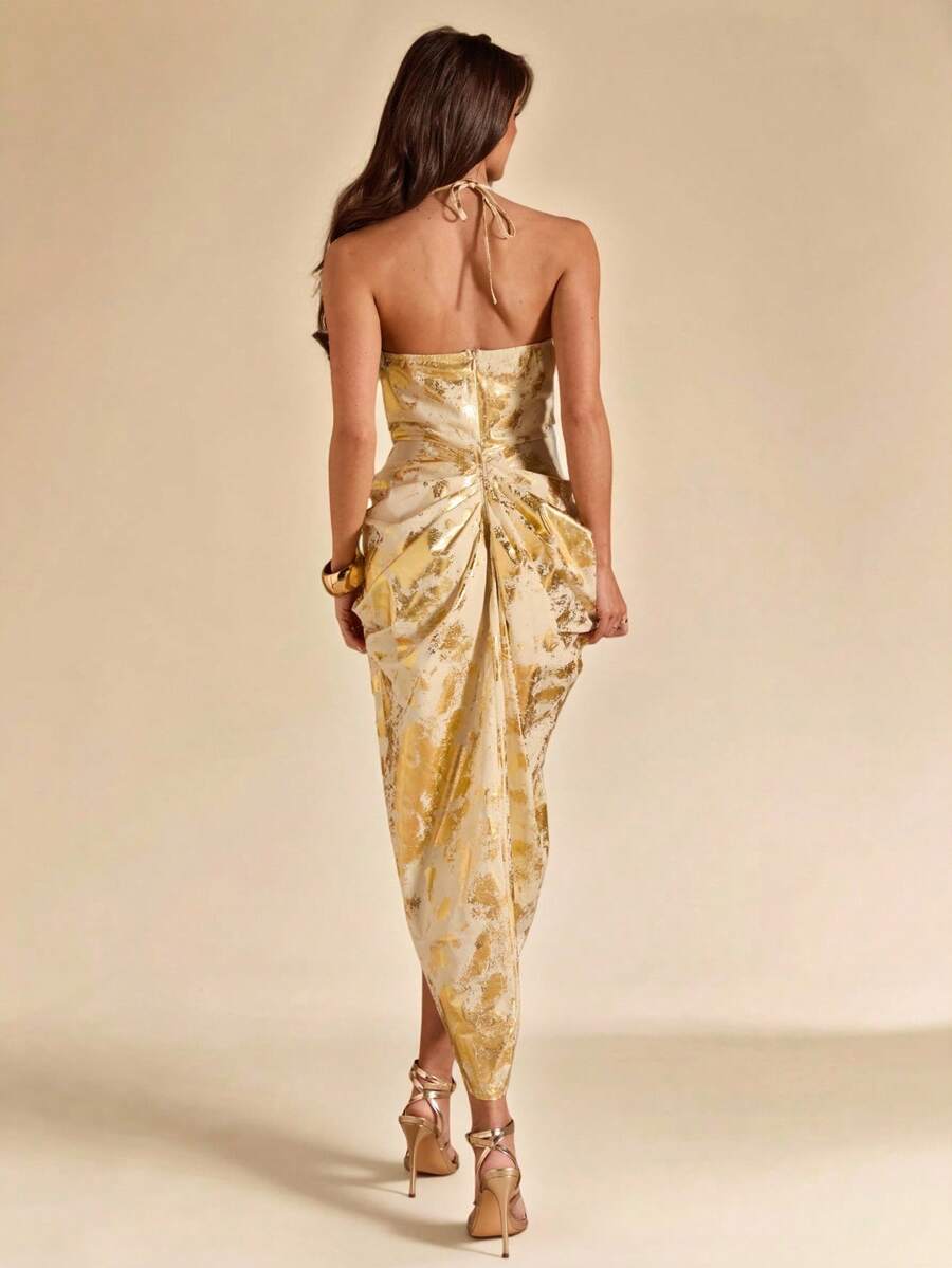 Back view cream gold halter midi dress with tie neck zipper back and ruched draped skirt
