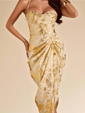Close-up cream gold-print dress with structured bodice sweetheart cups and pleated side drape