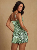 Back view of mint green glitter romper with fitted shape