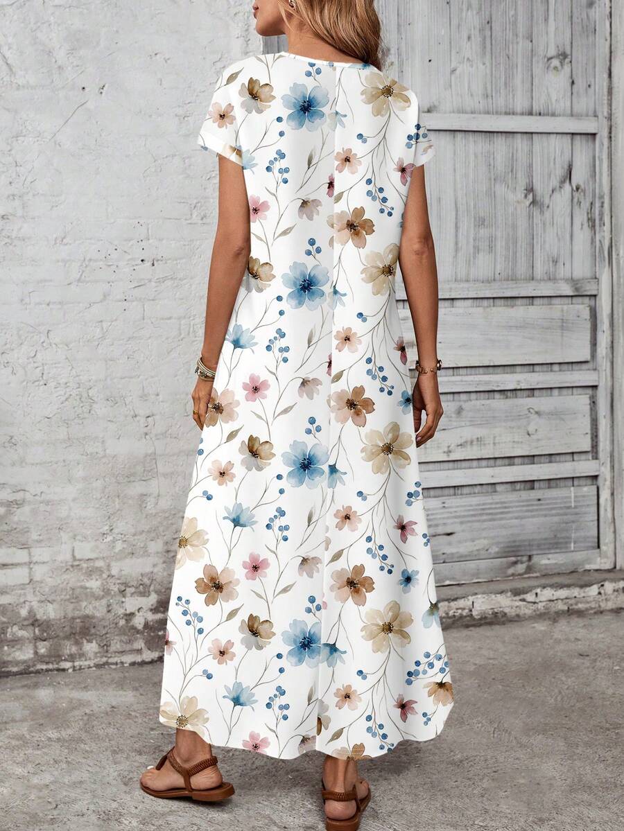 Back view of blue tan small floral maxi dress with center back seam