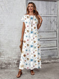 Full body front view of blue tan vine floral loose maxi dress