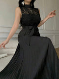 Front view of lace bodice pleated maxi dress showing visible color, print, and silhouette