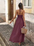 Back view of red plum boho halter maxi dress with open back and halter tie