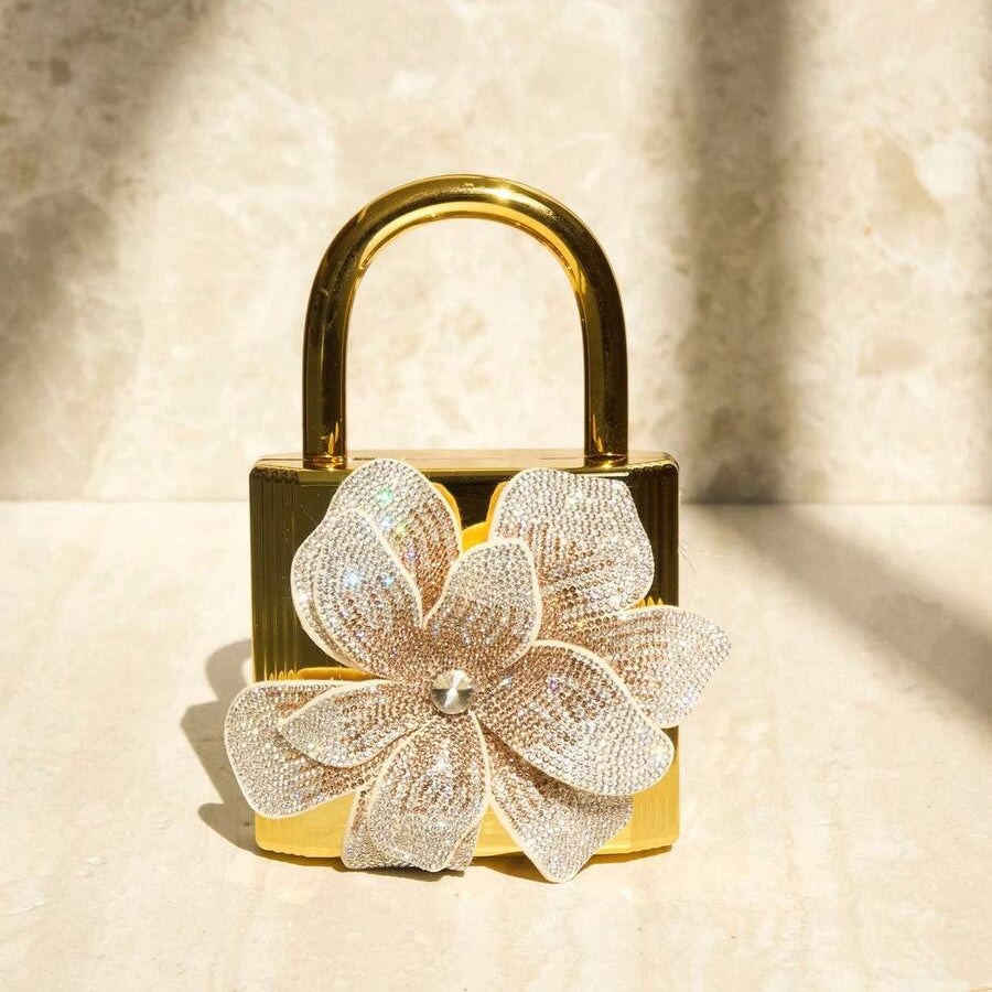 Elevate your evening look with this stunning rhinestone floral crossbody bag. Crafted with luxurious solid-color design and eye-catching mirror texture detailing, it's the perfect companion for parties, galas, and formal occasions. The elegant rhinestone embellishments catch the light beautifully, adding sophistication to any outfit. Wear it crossbody for hands-free convenience or adjust the strap for your preferred style. A timeless accessory that transforms any formal ensemble into something truly memorab