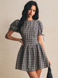 Navy beige plaid mini dress with puff sleeves and curved waist seam front view