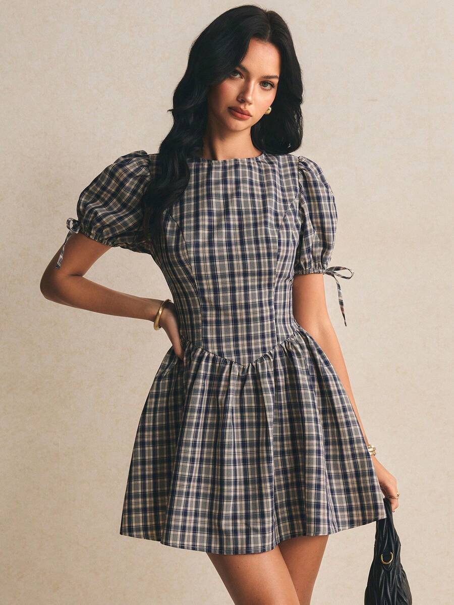 Navy beige plaid mini dress with puff sleeves and curved waist seam front view