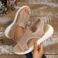 Top view of taupe knitted mesh slingback sandals shown held and worn