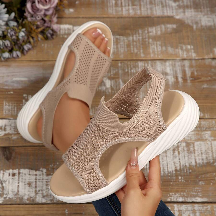 Top view of taupe knitted mesh slingback sandals shown held and worn
