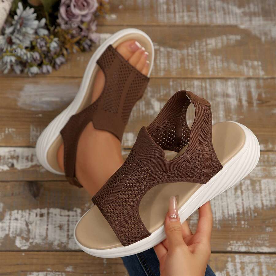 Top view of coffee brown mesh slingback wedge sandals shown held and worn