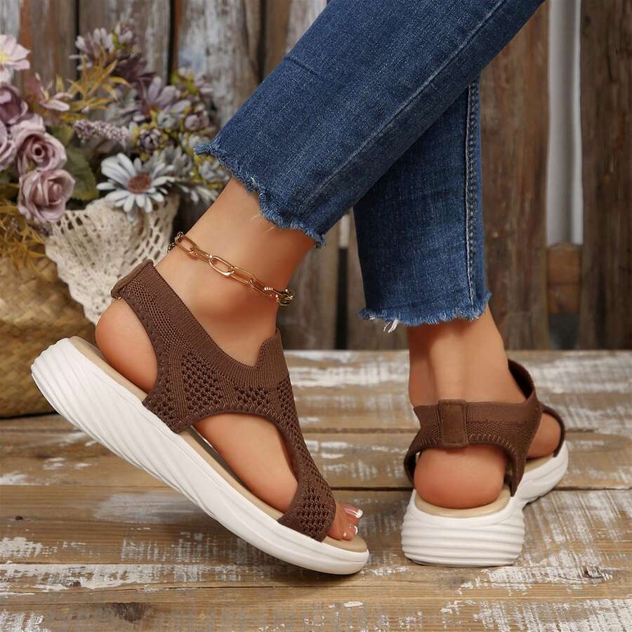 Rear side view of coffee brown mesh wedge sandals with open heel