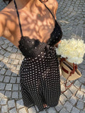 Capture effortless elegance with this blue plaid halter maxi dress, designed to blend classic charm with modern sophistication.