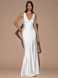 Front view of red sleeveless deep V-neck maxi dress with crossed open back, shown for wedding and evening wear