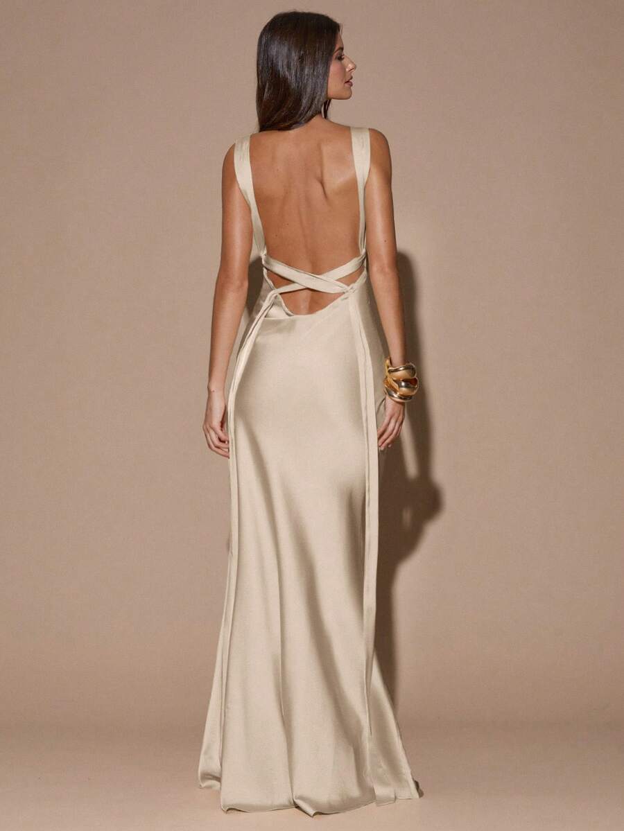 Back view of yellow sleeveless deep V-neck maxi dress with crossed open back, shown for wedding and evening wear