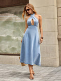 Full front view of light-blue crossover halter denim dress with keyhole neckline and flared skirt