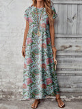 Front view of teal aqua botanical floral maxi dress with sandals