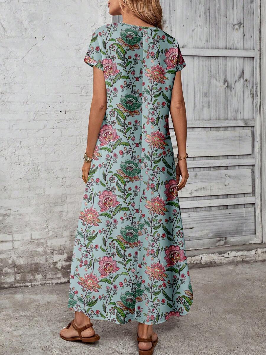 Back view of teal aqua floral maxi dress with center seam