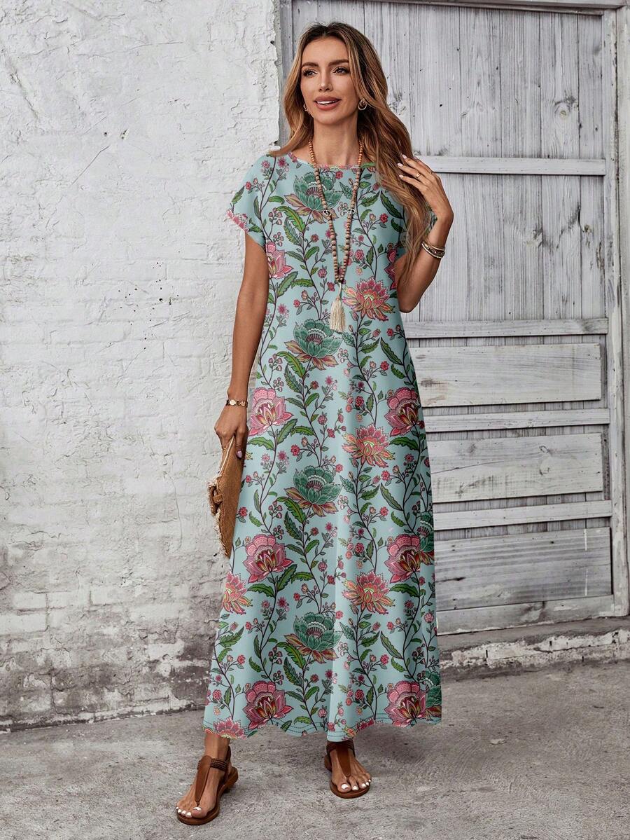 Full body front view of teal botanical loose maxi dress