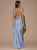 Front view of coral pink sleeveless deep V-neck maxi dress with crossed open back, shown for wedding and evening wear