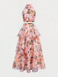 Back view of aqua floral crop top with zipper and layered long skirt