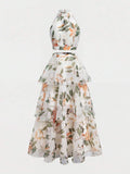 Back view of pink botanical crop top and cascading three-tier skirt