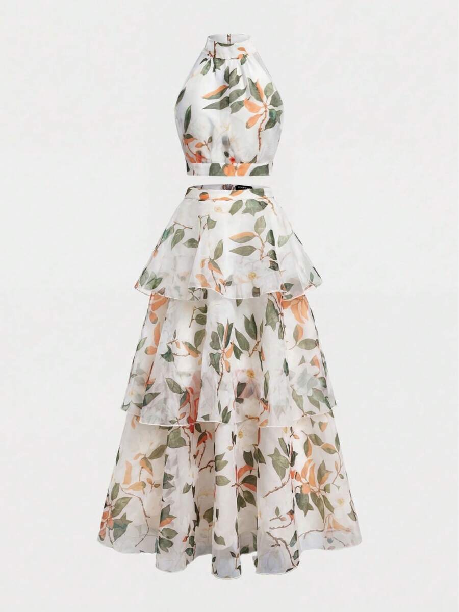 Back view of pink botanical crop top and cascading three-tier skirt