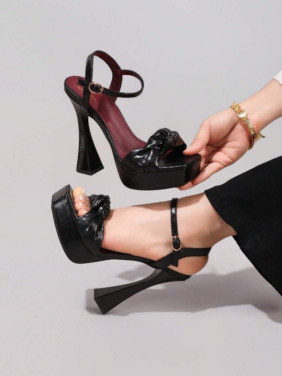 Black glossy bow platform sandal view 3 with open toe and ankle strap