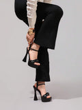 Black glossy bow platform sandal view 5 with open toe and ankle strap
