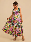 Angled front view of colorful botanical cami dress with full skirt