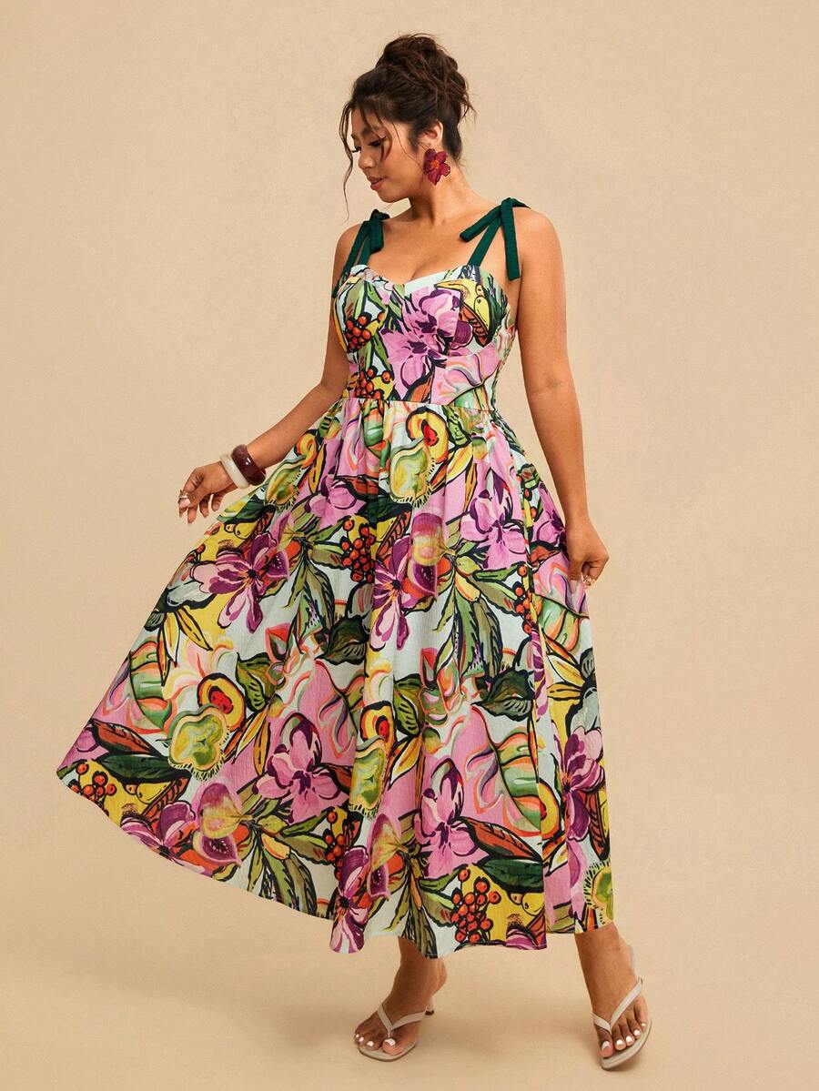 Angled front view of colorful botanical cami dress with full skirt