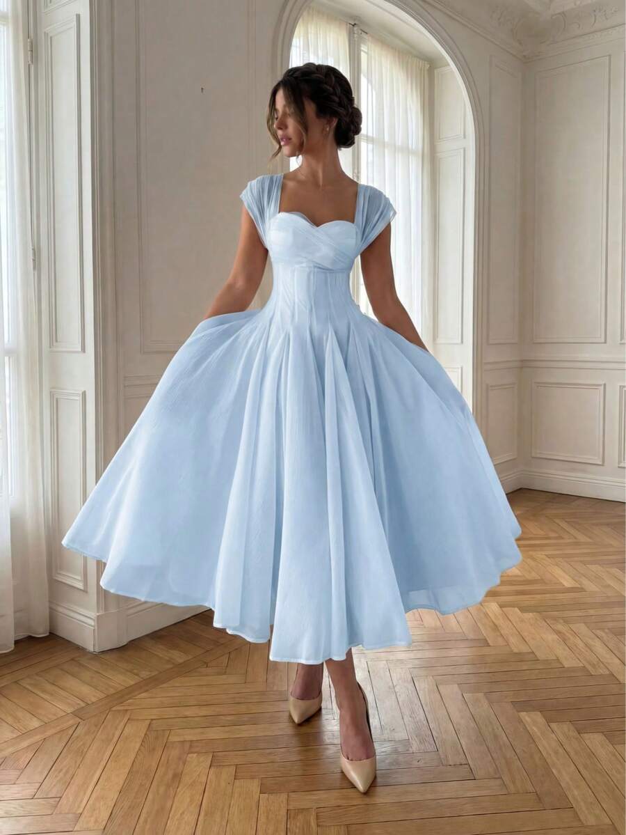 Front View of powder blue colorblock A-line midi dress with cap sleeves for wedding guest styling