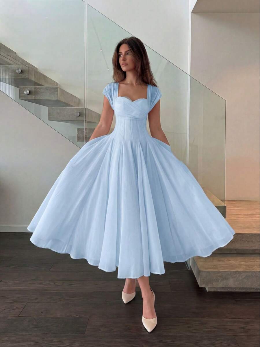 Front Full-Length View of powder blue colorblock A-line midi dress with cap sleeves for wedding guest styling