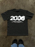 Front flat lay of black crew-neck T-shirt with distressed 2000 internet text graphic