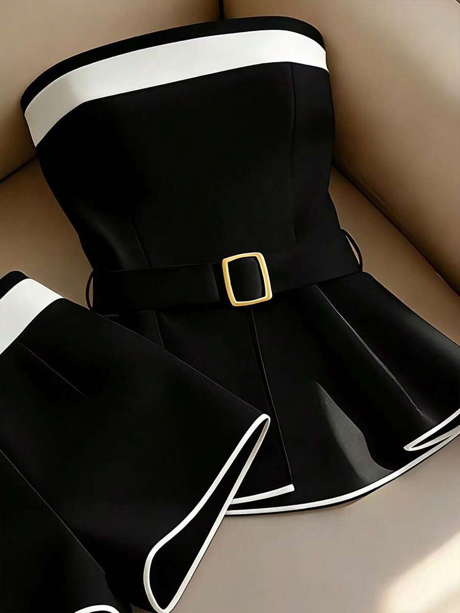 Elevate your summer wardrobe with this sophisticated 2-piece set designed for the modern commuter. The strapless bandeau top features elegant contrast binding and an asymmetrical cut, paired with a sleek mini shorts in a timeless colorblock design. The belted silhouette creates a polished, office-ready look that transitions seamlessly from desk to evening plans. Crafted from a premium 95% polyester and 5% elastane blend, this set offers a slim fit with a semi-sheer finish for an understated elegance. 
