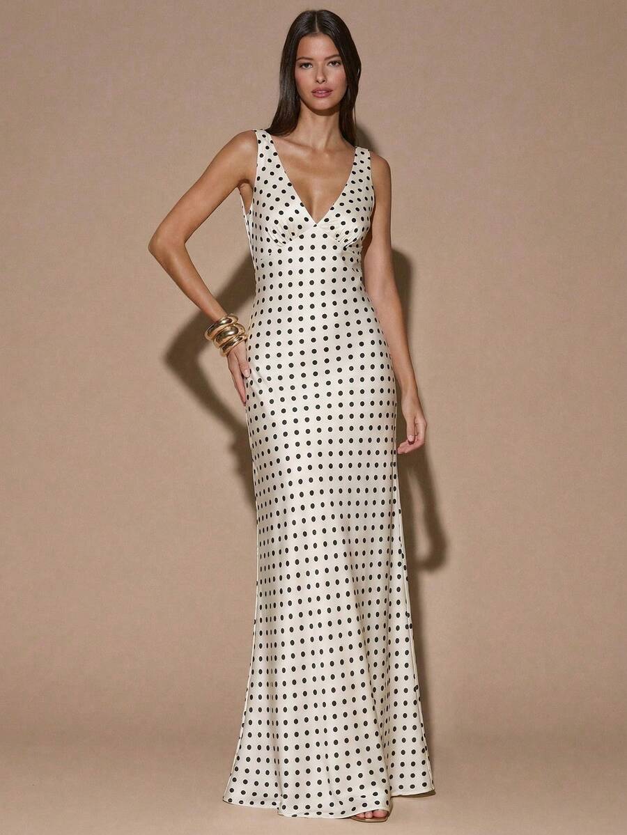 Front view of ivory sleeveless deep V-neck maxi dress with crossed open back, shown for wedding and evening wear