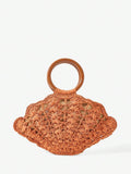 Back view burnt orange woven straw shell bag with brown round handle