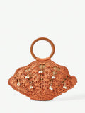 Burnt orange straw shell shaped beach bag with brown handle and pearl shell charms