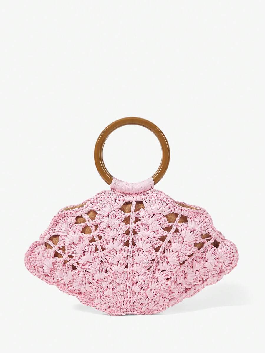 Back view light pink woven straw shell bag with brown circular handle