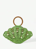 Green straw shell shaped beach bag with brown round handle and pearl shell charms