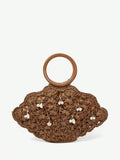 Dark brown straw shell shaped beach bag with pearl and shell charm dangles