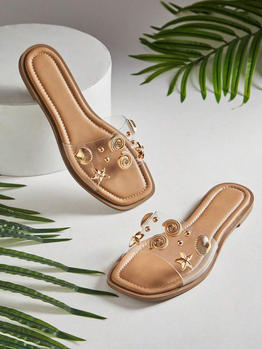 Step into summer style with these glamorous sea shell decor sandals. Featuring a clear one-band design and chic square toe silhouette, these slip-on sandals offer effortless elegance for warm-weather days. The transparent upper showcases delicate shell embellishments, creating a sophisticated coastal-inspired look. Perfect for beach outings, casual strolls, or poolside relaxation, these versatile sandals pair beautifully with sundresses, shorts, or beachwear. 