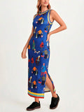 Front three-quarter studio view with side slit of royal blue illustrated sleeveless maxi dress