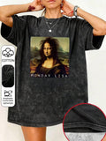 Worn view of washed charcoal Mona Lisa parody T-shirt with wide sleeves and curved hem