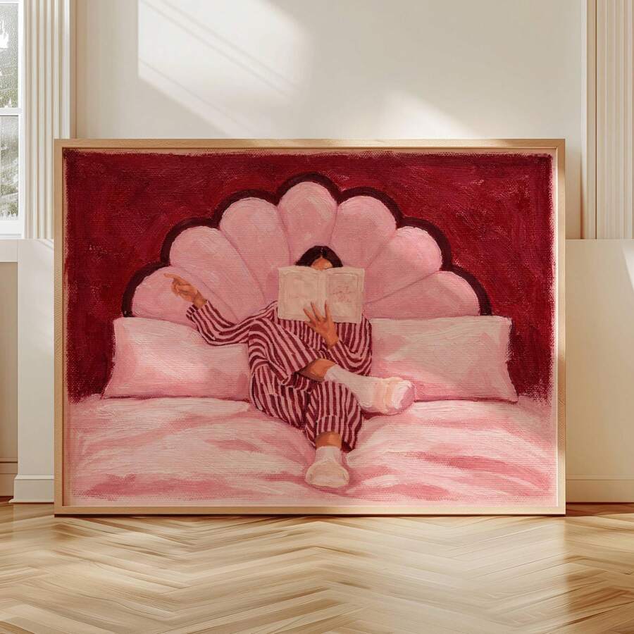 Near-front floor display of textured pink reader canvas in a pale wood frame