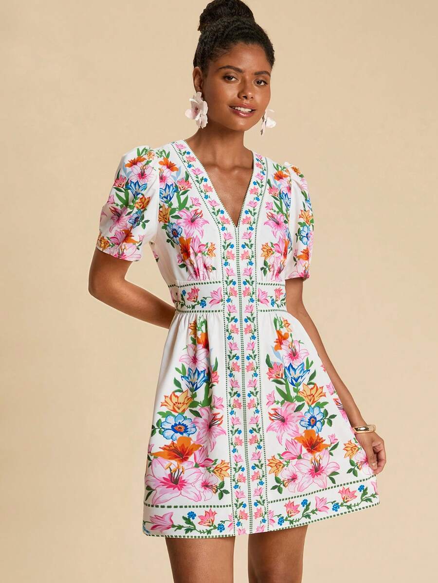 Escape to paradise in this vibrant Travachic mini dress, designed for sun-soaked getaways and carefree adventures. Featuring a flattering high-waist A-line silhouette with playful puff sleeves and charming pom-pom details, this boho beauty combines tropical flair with effortless elegance. The V-neckline and flounce hem add movement and dimension, while the loose fit ensures all-day comfort. Perfect for beach days, resort wear, or festival celebrations.
