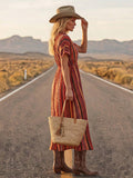 Side view of flowing floral dress with puff sleeves