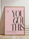 Close-up of inspirational lettering on pink wall art