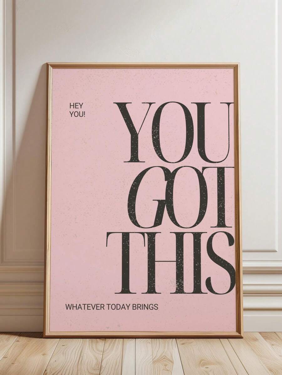 Close-up of inspirational lettering on pink wall art