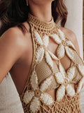 Close-up front view of khaki floral crochet swim cover-up showing halter neck and cutout bodice