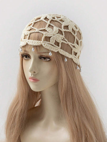 Cream floral crochet beanie cap with open lattice pattern and pearl dangling bead trim